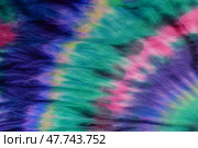 Abstract painted background. Multi-colored pattern in the shibori technique on a thin knitted fabric. Multi-color texture. batik.Textile shibori. Ткань окрашена методом узелковый батик. Стоковое фото, фотограф Ольга Солопова / Фотобанк Лори