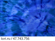 Abstract painted background. Multi-colored pattern in the shibori technique on a thin knitted fabric. Multi-color texture. batik.Textile shibori. Узелковый батик. Стоковое фото, фотограф Ольга Солопова / Фотобанк Лори