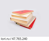 Stack of books in colour covers with white sheets isolated on a white background. Стоковое фото, фотограф Елена  Попкова / Фотобанк Лори