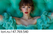 A model poses confidently in a stunning turquoise dress adorned with ruffles, showcasing elegance against a vivid, textured backdrop. Стоковое AI-изображение, AI-художник Данила Большаков / Фотобанк Лори