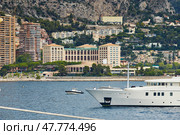 Monaco, Monte-Carlo, 4 sept 2015: Megayacht most expensive Felix, the preparation of the yacht show MYS in September, sunny day, hotel Monte-Carlo Bay in background, Italy, Fraser Yachts. Редакционное фото, фотограф Vladimir Drozdin / Фотобанк Лори