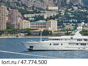 Monaco, Monte-Carlo, 4 sept 2015: Megayacht most expensive Felix, the preparation of the yacht show MYS in September, sunny day, hotel Monte-Carlo Bay in background, Italy, Fraser Yachts. Редакционное фото, фотограф Vladimir Drozdin / Фотобанк Лори