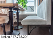 Empty beige upholstered chairs in a coffee shop in the morning. Стоковое фото, фотограф Артем Курутин / Фотобанк Лори