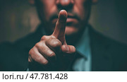 A man in a formal suit confidently makes a hand gesture, potentially signaling authority or emphasis. Стоковое AI-изображение, AI-художник Данила Большаков / Фотобанк Лори