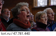 A choir of elderly individuals singing in unison, showcasing teamwork and harmony as they perform together. Стоковое AI-изображение, AI-художник Данила Большаков / Фотобанк Лори