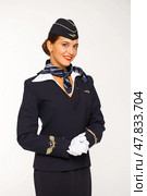 RUSSIA, MOSCOW: 21 SEPTEMBER 2019. Beautiful stewardess dressed in official blue uniform of Aeroflot Airlines. Редакционное фото, фотограф Андрей Аркуша / Фотобанк Лори