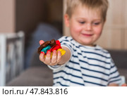 A little boy is playing with plasticine. Fine motor skills-developing games for children. The kid makes a horse. Useful games for child development. Стоковое фото, фотограф Photojuli / Фотобанк Лори
