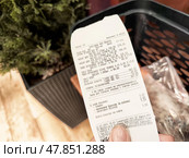 Kirov, Russia - February 22, 2025: Receipt documenting recent grocery purchase at a local store in the afternoon, with details of items bought and totals. Редакционное фото, фотограф Кривошеина Елена Леонидовна / Фотобанк Лори