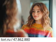 Девушка в ярком джемпере смотрится в зеркало. Стоковое AI-изображение, AI-художник Щеголева Ольга / Фотобанк Лори