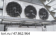Industrial air conditioning units with rotating fans. Стоковое видео, видеограф Андрей Знаменский / Фотобанк Лори