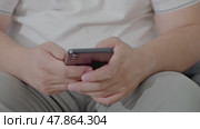 Man using ChatGPT in the mobile phone. This app is a chatbot based on Artificial Intelligence developed by OpenAI. Dubai, UAE: 07.05.2025. High quality. Стоковое видео, видеограф Feruza Tashmetova / Фотобанк Лори