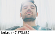 Sad depressed man in depression and bad mood, looking down and touching forehead, loneliness and pain concept. Fighting with yourself, meditation. Стоковое AI-видео, аниматор ALLA YURTAYEVA / Фотобанк Лори