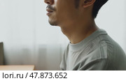 Sad depressed man in depression and bad mood, looking down and touching forehead, loneliness and pain concept. Fighting with yourself, meditation. Стоковое AI-видео, аниматор ALLA YURTAYEVA / Фотобанк Лори