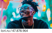 A jovial man with dreads, eyeglasses and chain, in a vibrant, colorful atmosphere brimming with joy and youthful energy, radiating pure happiness. Стоковое AI-изображение, AI-художник Данила Большаков / Фотобанк Лори