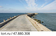 Southern long concrete pier with breakwaters on the Baltic Sea on the Vistula Spit. Baltiysk. Russia. Стоковое фото, фотограф Elena Odareeva / Фотобанк Лори