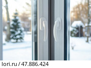 Two New plastic PVC window with white metal frame, handles. installed at modern house, view of blurred winter backyard. Advertising. Typical installation of insulated glazing windows with uPVC frame. Стоковое AI-изображение, AI-художник Марина Демидюк / Фотобанк Лори
