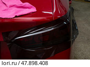 Tinting of the rear headlights of the car.Car design.Detaling center. Стоковое фото, фотограф Александр Поташев / Фотобанк Лори