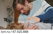 Happy Father Playing with Daughter. Three Years Baby Smiling, Laughing, Looking at Daddy. Man Showing Affection to Child. Candid Real Emotion. Beard Dad and Little Kid Girl. Authentic Family Lifestyle. Стоковое видео, видеограф Марина Демидюк / Фотобанк Лори