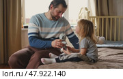 Happy Father Playing with Daughter. Three Years Baby Smiling, Laughing, Looking at Daddy. Man Showing Affection to Child. Candid Real Emotion. Beard Dad and Little Kid Girl. Authentic Family Lifestyle. Стоковое видео, видеограф Марина Демидюк / Фотобанк Лори