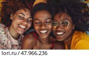 Three African American women share a genuine moment of friendship and laughter, huddled together indoors, radiating happiness and togetherness. Стоковое AI-изображение, AI-художник Данила Большаков / Фотобанк Лори