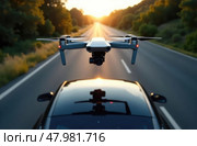 Drone takes off from the roof of a modern car driving on the road, front view from above. Use of drones in mapping of territories and reliefs. Стоковое AI-изображение, AI-художник Коханова Наталья / Фотобанк Лори