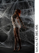 Red-haired woman trapped in a delicate net of web during a creative dance. Стоковое фото, фотограф Гурьянов Андрей / Фотобанк Лори