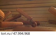 Wooden fasteners fall on the table. Filmed on a high-speed camera at 1000 fps. Стоковое видео, видеограф Артем Шадрин / Фотобанк Лори