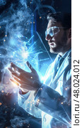 A scientist manipulates glowing energy while focused in a dimly lit laboratory filled with equipment. Стоковое AI-изображение, AI-художник Данила Большаков / Фотобанк Лори