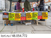 Street protest with colorful signs and banners. London, UK, 16 March 2024. Редакционное фото, фотограф Zydrius Tartenis / Фотобанк Лори