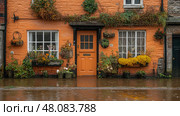 The vibrant orange house, adorned with flowers, is partially submerged in floodwaters during a heavy rainstorm in a charming village. Стоковое AI-изображение, AI-художник Данила Большаков / Фотобанк Лори