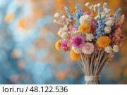Detailed view of a vibrant bouquet of dried flowers with colorful accents. Детальный вид яркого букета из сухоцветов с разноцветными акцентами. Стоковое AI-изображение, AI-художник Katsiaryna Repich / Фотобанк Лори