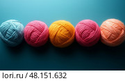 Top-Down View of Scattered Colorful Yarn Balls on Playful Textured Background.  разложенные разноцветные клубки пряжи на текстурированном фоне. Стоковое AI-изображение, AI-художник Katsiaryna Repich / Фотобанк Лори