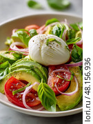 Fresh Salad With Creamy Mozzarella, Ripe Tomatoes, and Avocados Served in a Bowl. Стоковое AI-изображение, AI-художник Юлия Гапеенко / Фотобанк Лори