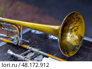 Trombone - fragment of wind brass orchestral musical instrument. Стоковое фото, фотограф Евгений Ткачёв / Фотобанк Лори