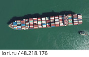Cargo ship filled with containers in port area. Стоковое видео, видеограф Михаил Коханчиков / Фотобанк Лори