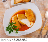 Golubtsy (cabbage rolls) served on table. Стоковое фото, фотограф Яков Филимонов / Фотобанк Лори