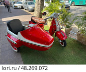 Retro Vespa scooter on the street. Редакционное фото, фотограф Irina Opachevsky / Фотобанк Лори