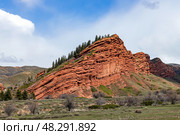 Red rocks seven oxen, 7 bulls, gorge Jety-Oguz. Travel destination in Kyrgyzstan. Стоковое фото, фотограф Екатерина Якименко / Фотобанк Лори