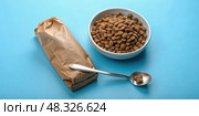 A Feast for Fido: a Bowl of Delight Next to a Bag of Goodies. Generative AI. Стоковое AI-изображение, AI-художник Roman Zavorotny / Фотобанк Лори