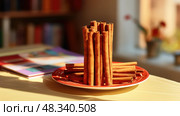 photo cinamon stick on table ai generated. Стоковое AI-изображение, AI-художник Vectorwin / Фотобанк Лори