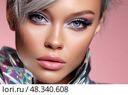 A woman with blue eyes and purple eyeshadow. Стоковое AI-изображение, AI-художник Ярославский Максим / Фотобанк Лори