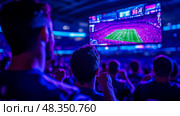 Excited fans gather in a dimly lit arena, cheering for their favorite teams during a thrilling esports match on a massive screen. Стоковое AI-изображение, AI-художник Данила Большаков / Фотобанк Лори