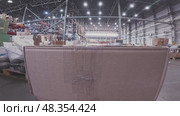 Shipping and logistics. Boxes in a warehouse in close-up, moving in a warehouse on a trolley or loader. First-person video from an action camera. A first-person POV captures the dynamic pulse of modern logistic. Стоковое видео, видеограф Владимир Разгуляев / Фотобанк Лори