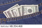 Доллары в кармане джинсов. Dollars bills in jeans pocket close-up. Стоковое фото, фотограф Татьяна Д / Фотобанк Лори