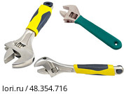 Разводные гаечные ключи на белом фоне. An adjustable wrenchs on a white background. Стоковое фото, фотограф Татьяна Д / Фотобанк Лори
