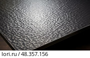 dimpled metal table top ai generated. Стоковое AI-изображение, AI-художник Vectorwin / Фотобанк Лори