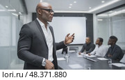 Confident businessman leading a presentation in modern office. Стоковое AI-видео, аниматор Юрий Поздников / Фотобанк Лори