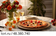 vegetrin pizza on a table ai generated. Стоковое AI-изображение, AI-художник Vectorwin / Фотобанк Лори