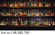 rum liquor bottles ai generated. Стоковое AI-изображение, AI-художник Vectorwin / Фотобанк Лори