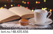 A white cup and saucer and a small muffin, Стоковое видео, видеограф Zakharova Natasha / Фотобанк Лори